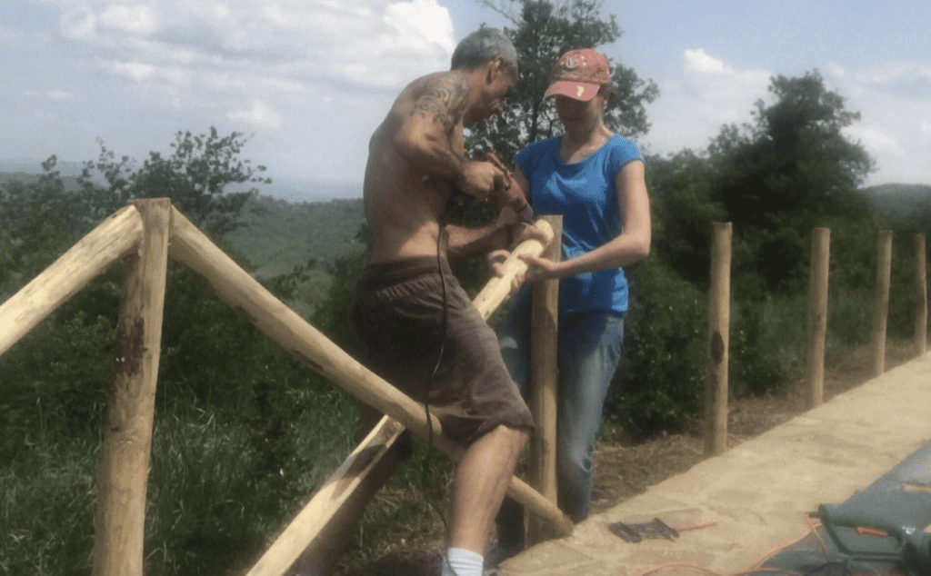 Tony and Andrea installing a wooden pool fence during an earlier villa improvement project.