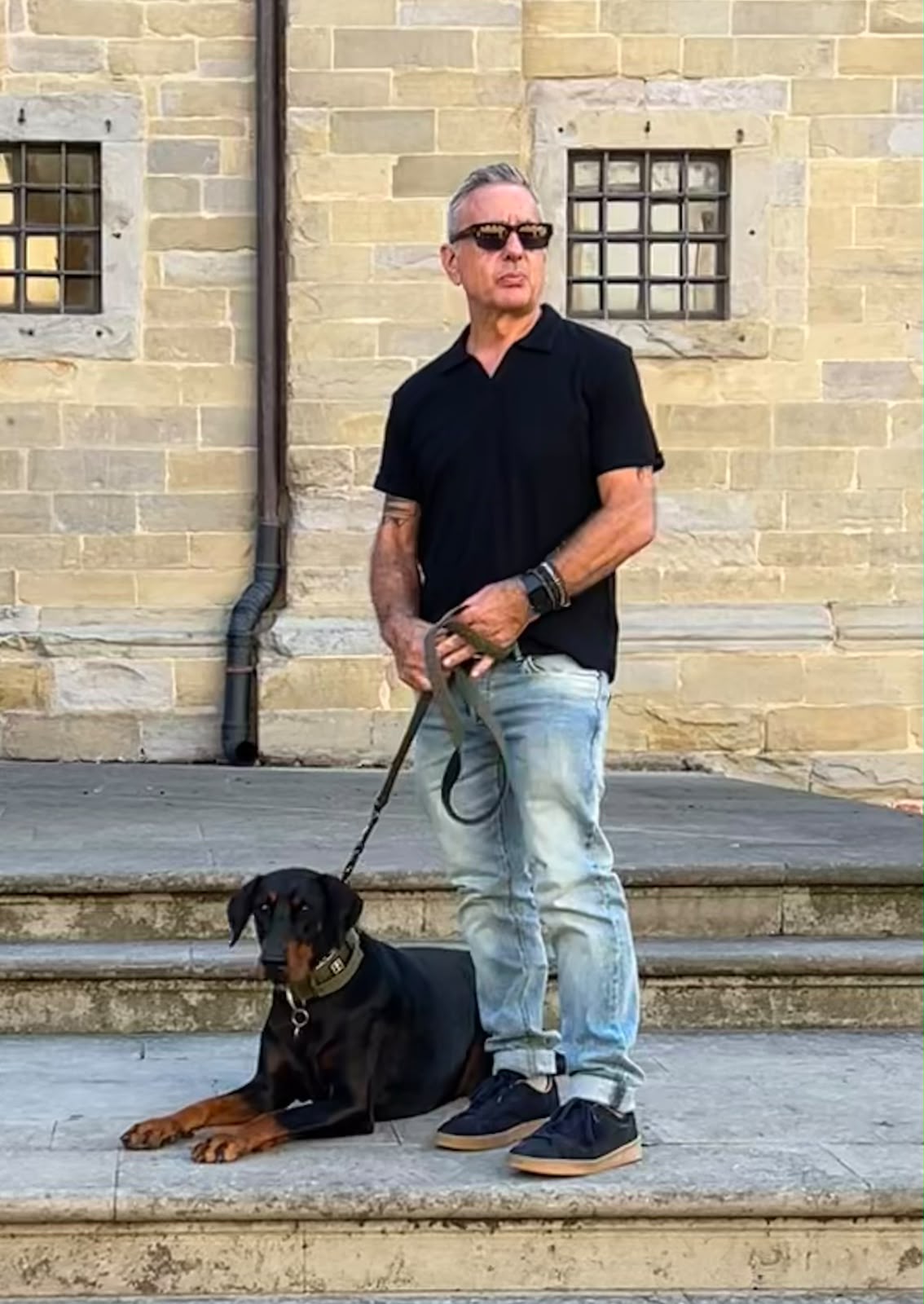 Tony Camerota, property manager at Antonio Umbria Villa Services, with his dog Dobby outside Citta di Castello church